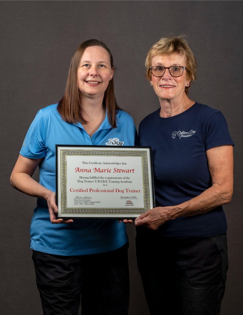Anna Marie Stewart holding her T.R.I.B.E. certification with Karen Laws